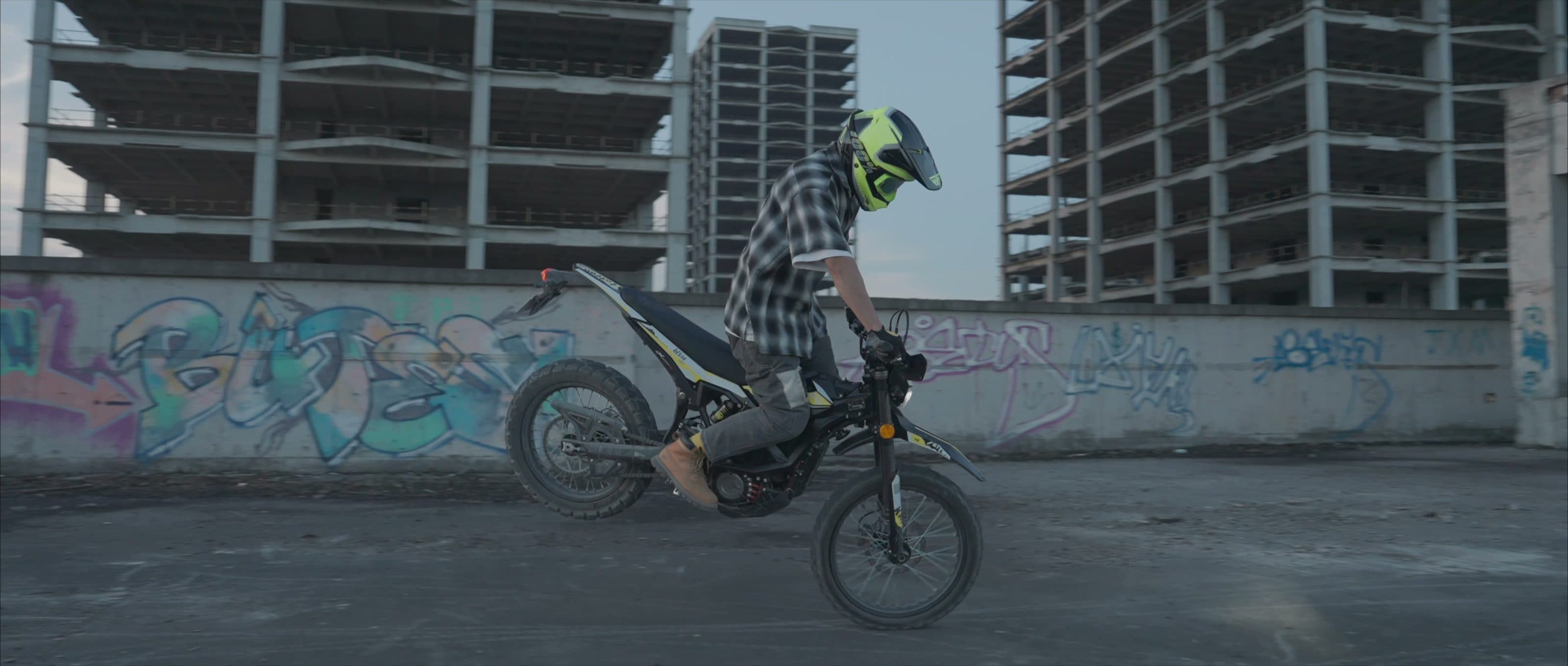 Rider accelerating an Ultra Bee across a rooftop
