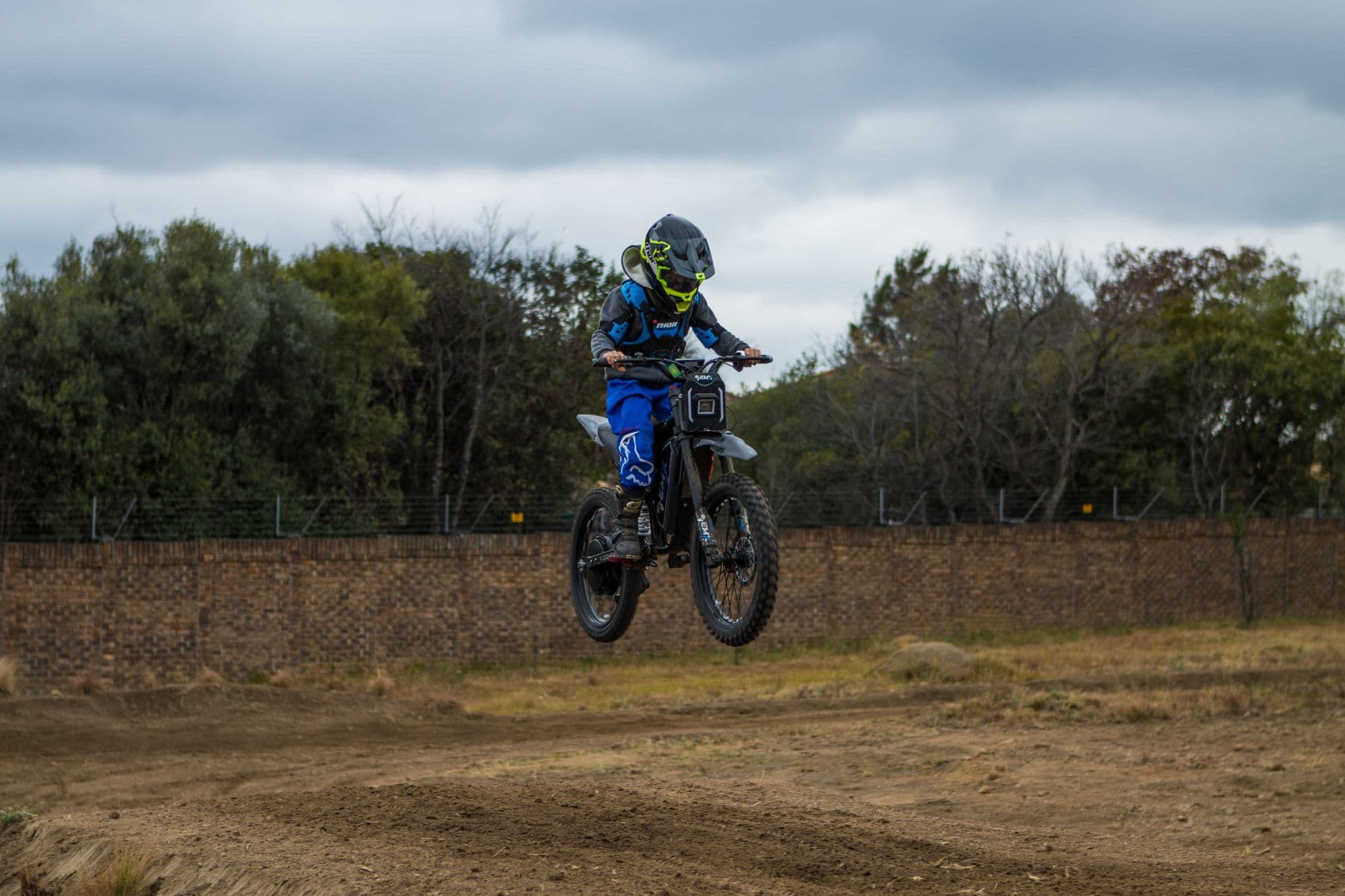 Rider in blue on track