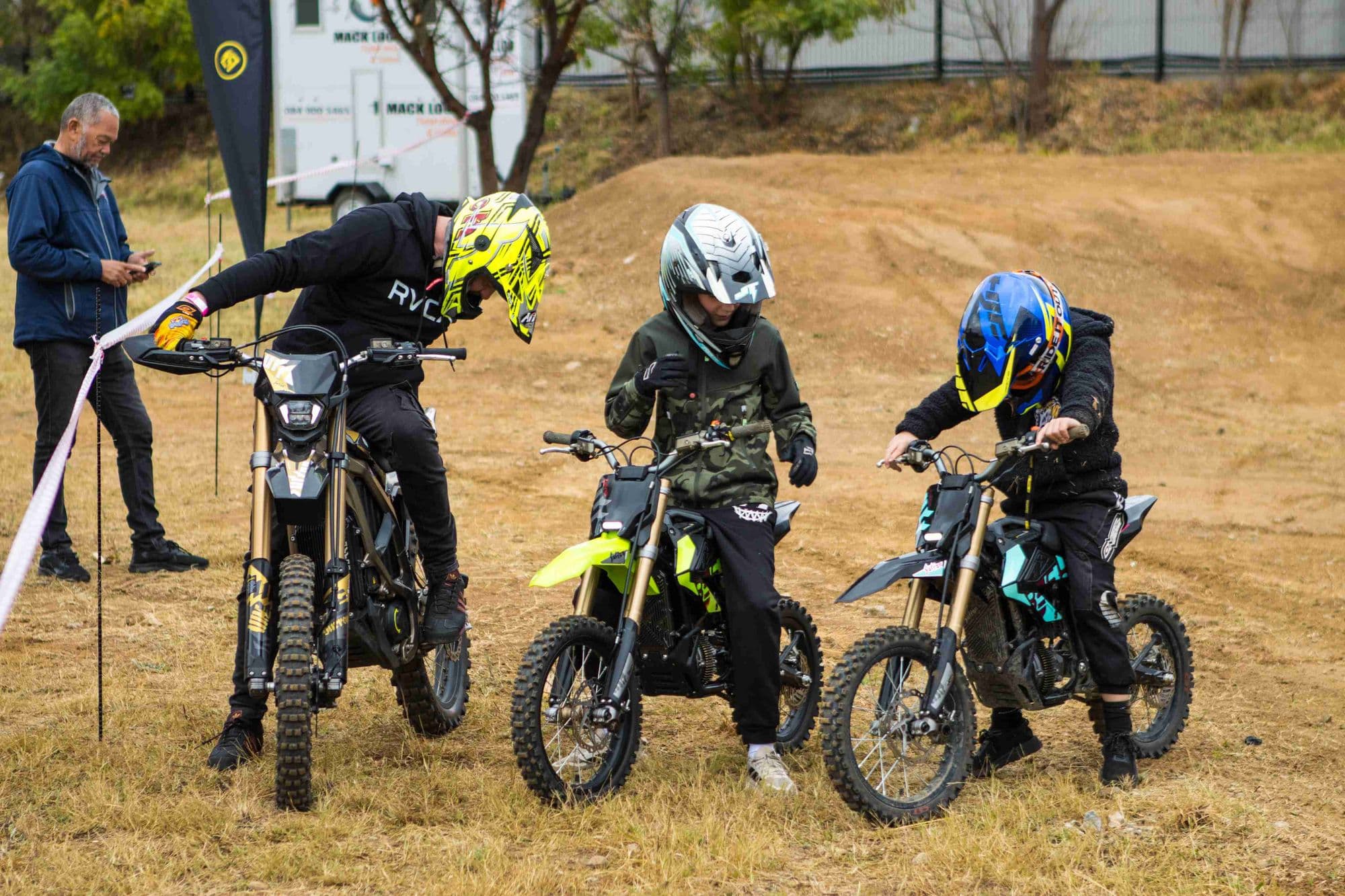 Young riders lining up on Surron bikes