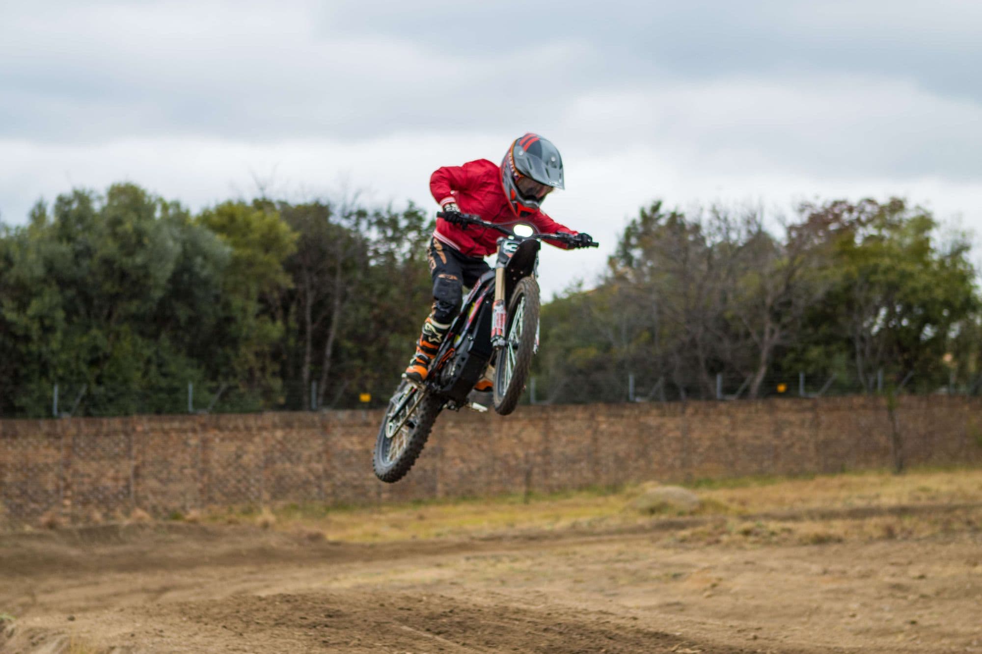 Rider whipping a jump