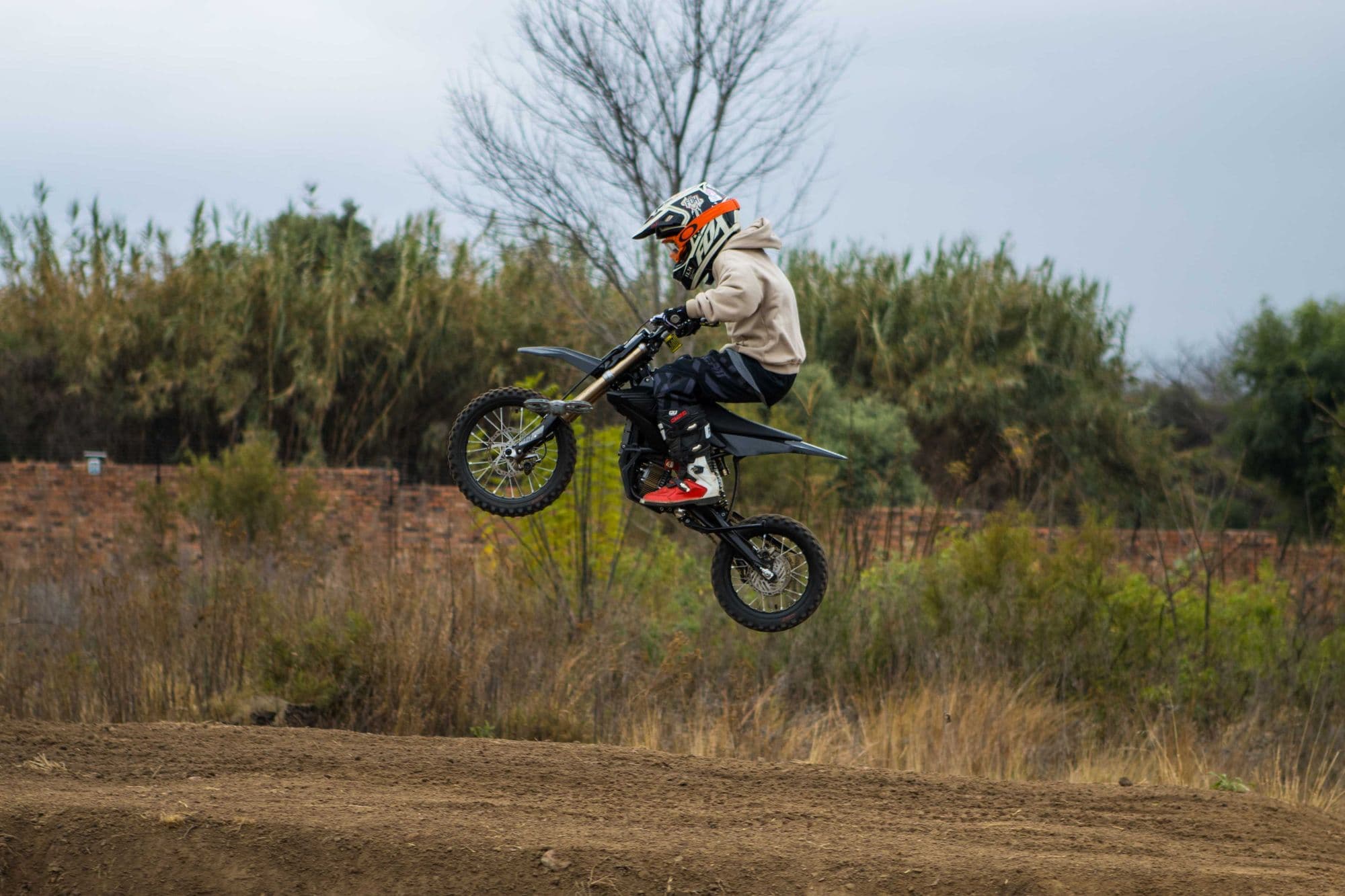Rider airborne over the bush