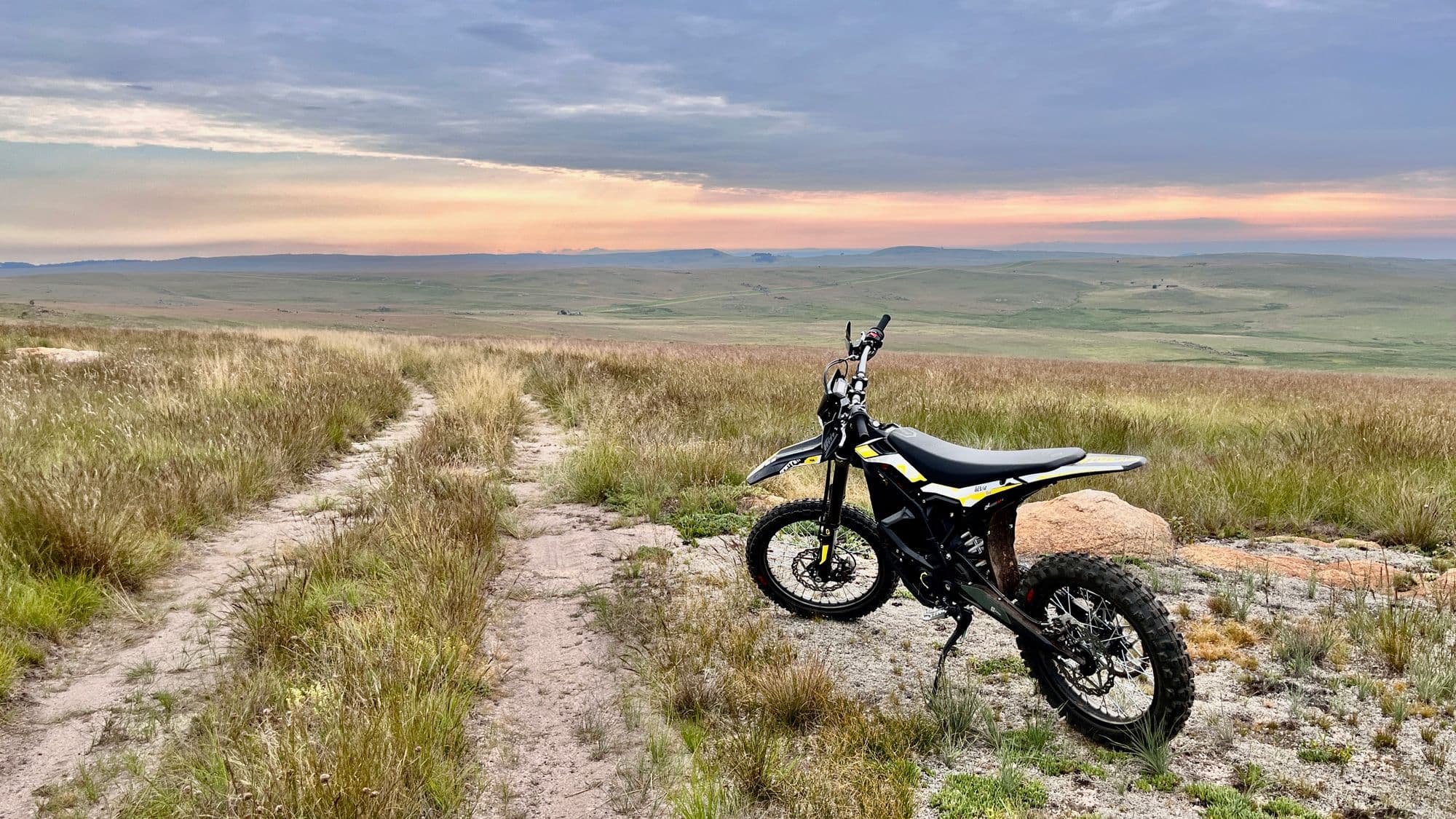 Surron parked on a grassland trail near Dullstroom